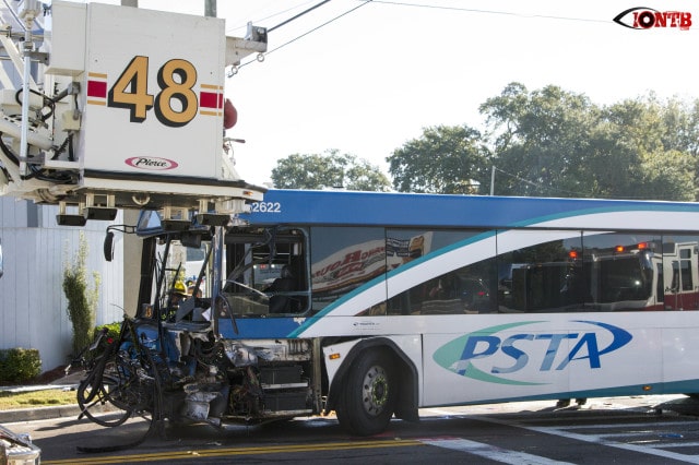 Significant damage visible to PSTA bus after colliding with dump truck which overturned.