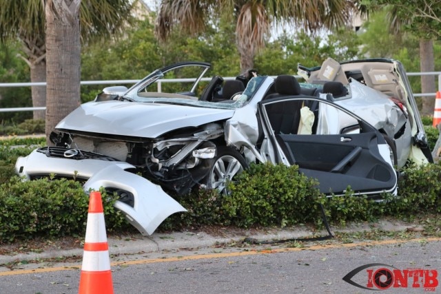 Severely damaged Nissan vehicle that woman was trapped in