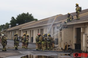 Firefighter work to find the source of the fire at 11100 Bryan Dairy Road