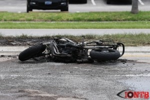 Burnt motorcycle on Park Street after fire extinguished