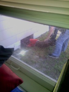 Mr. Burge being removed from under the home by Officers from St. Petersburg Police (Photo: Candi LIttle)