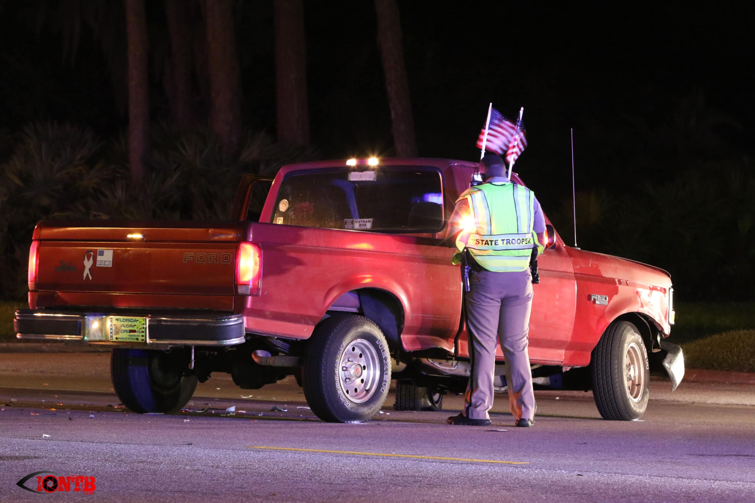 FHP Trooper examines the pickup truck involved in the crash